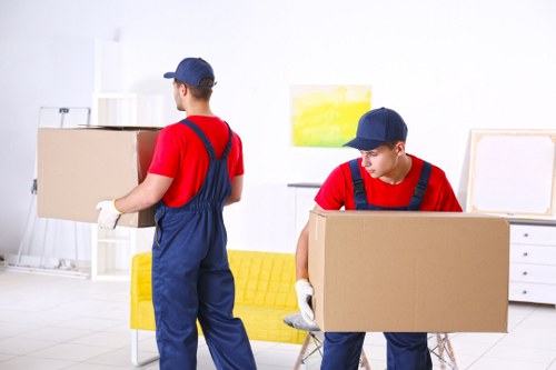 Removal team preparing boxes and furniture for a move in Finsbury Park