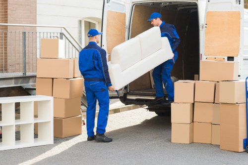 Furniture pick-up service handling bulky items in a Finsbury Park residential street