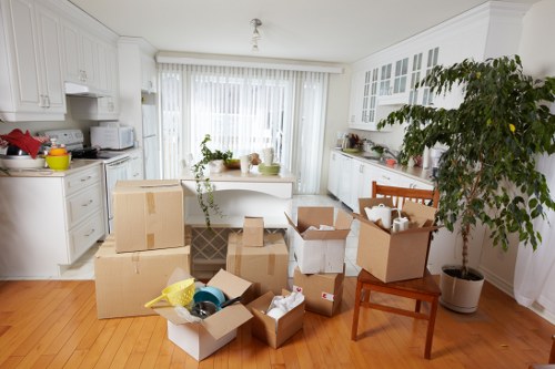 Assorted packing materials including tape, wrap, and boxes for local moves