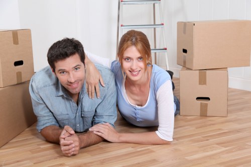 Household boxes and furniture being loaded into a removal van