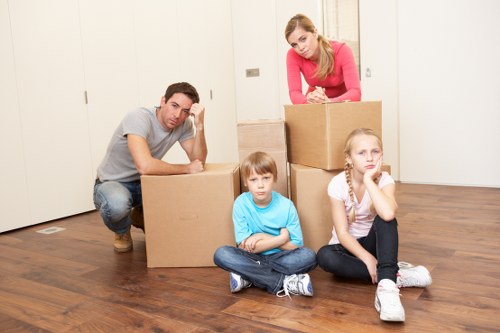 Van moving service handling boxes and household items carefully