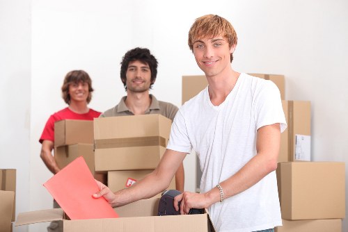 Family home moving preparations with boxes and furniture